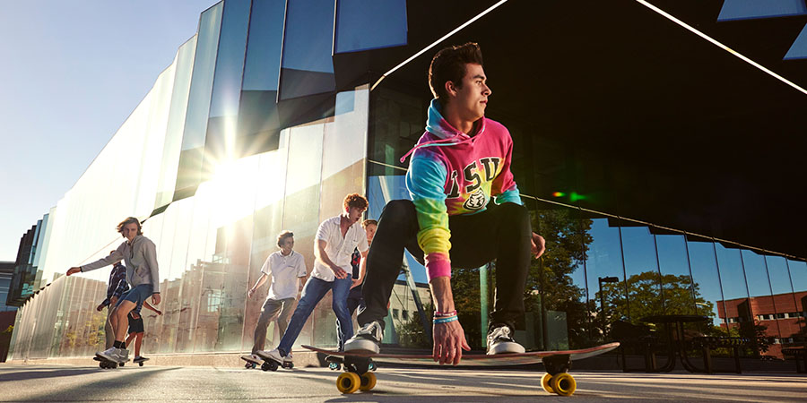 skateboarders in front of building